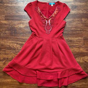 Buttons red holiday dress w sequin & lace detailing on the bust & ruffle skirt